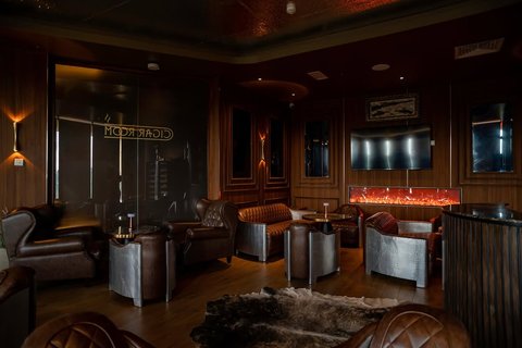Where the city lights meet refined indulgence.

An intimate setting of premium cigars, fine spirits, and unforgettable conversations, elevated by panoramic city views and timeless elegance.

Every detail is designed for those who appreciate the finer things.  Swipe through and discover the experience.