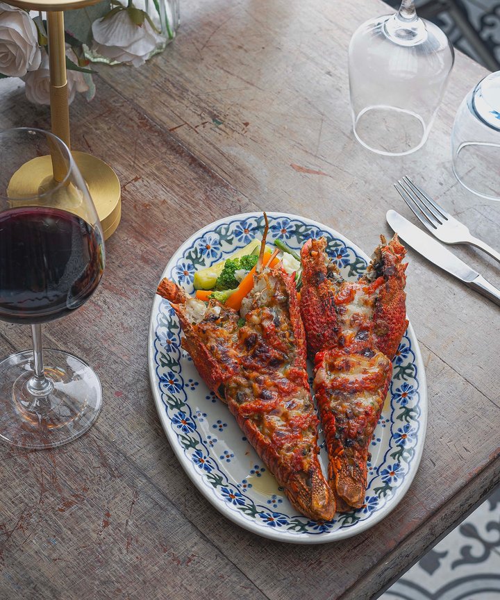 Grilled lobster, a glass of red, and zero regrets This is what slow, indulgent dining should feel like.
