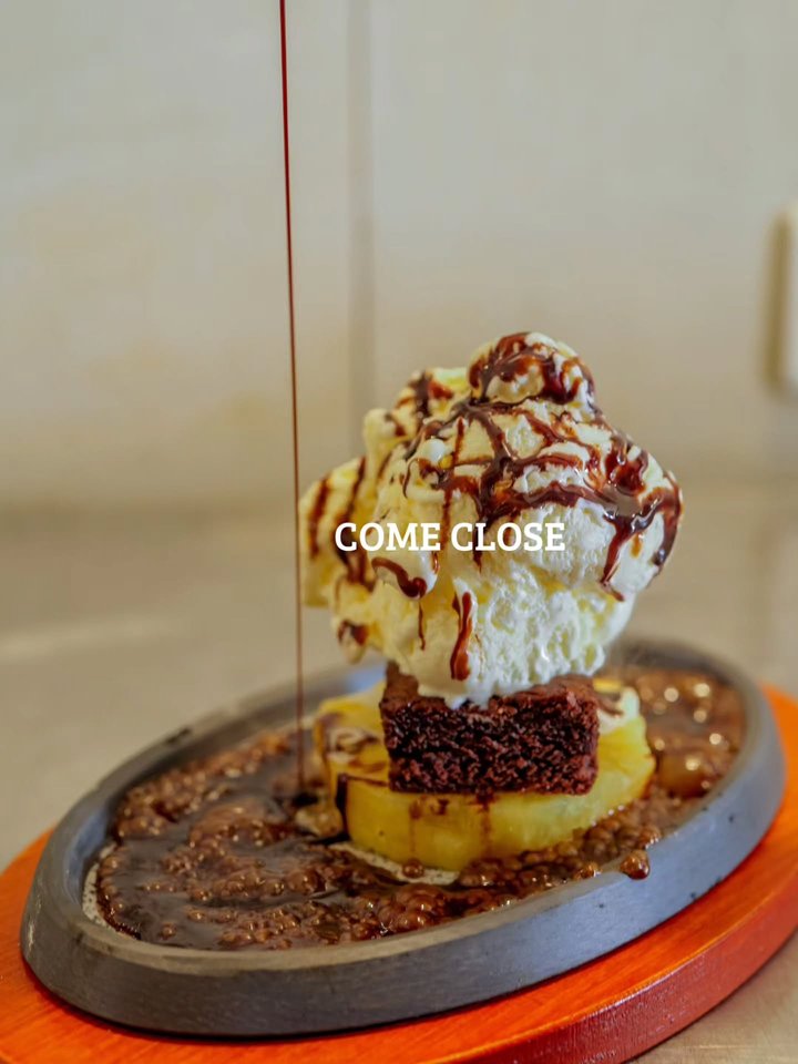 Proceed with caution. And an extra pair of cutlery A warm, irresistible brownie, served sizzling with a scoop of ice-cream. The kind of dessert that speaks for…