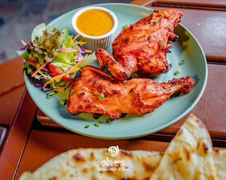 The naan is warm. The chicken is charred. Your appetite knows what to do.